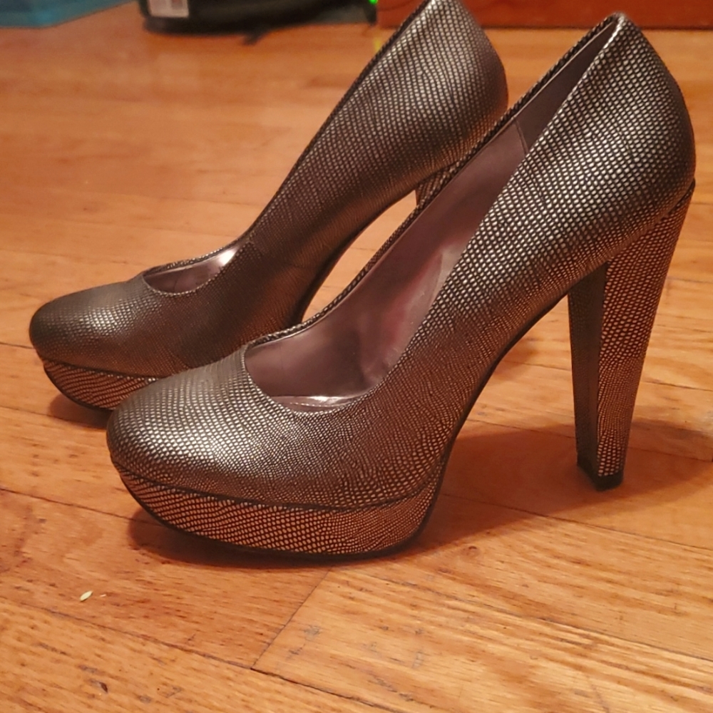 Calvin Klein, size 7.5, metallic platform heels.